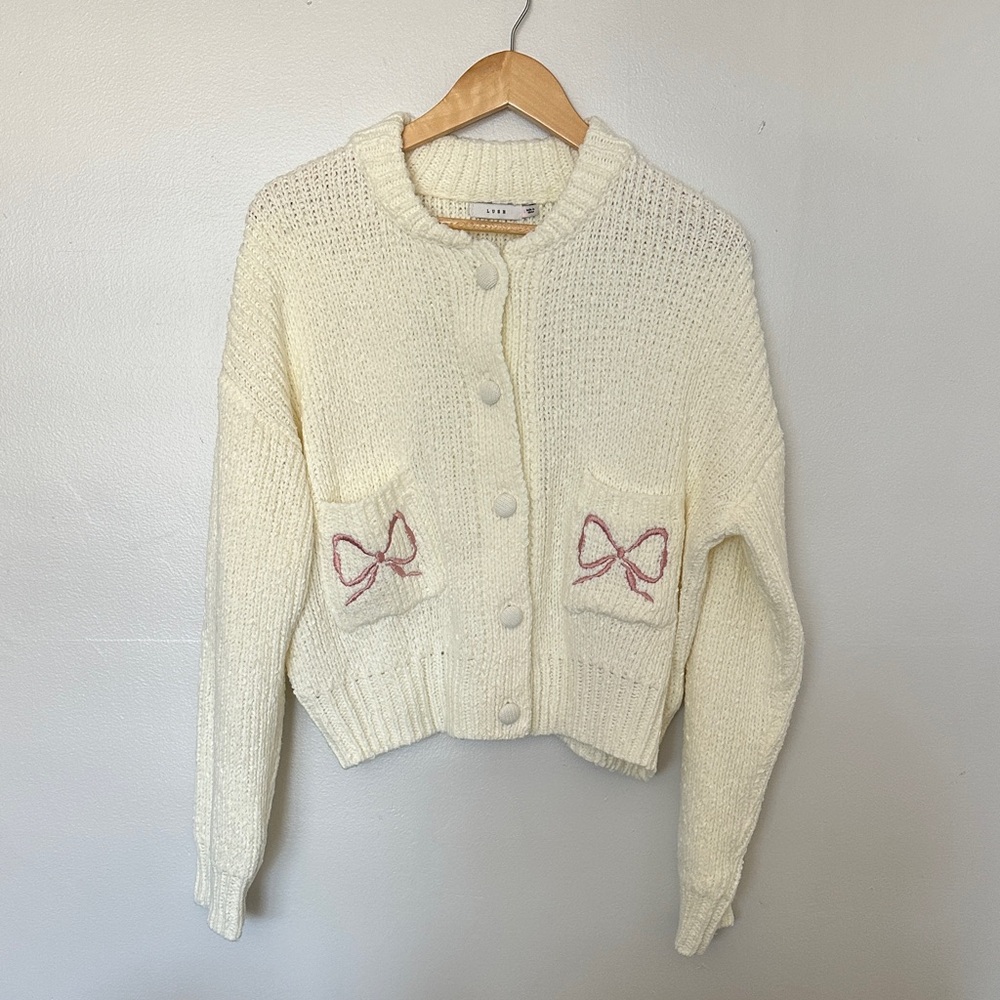 Lush Cream Cardigan with Pink Bow Accents
